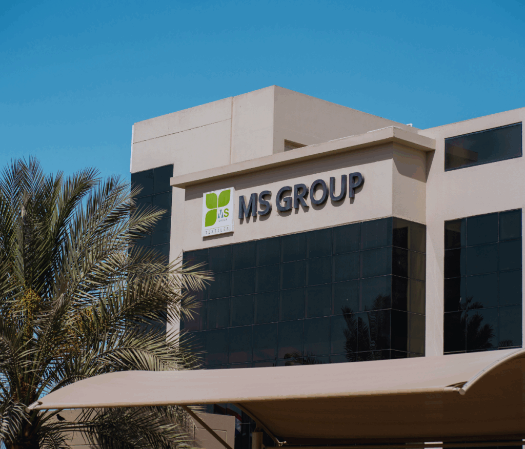 MS Group head office exterior with logo and greenery ready to help